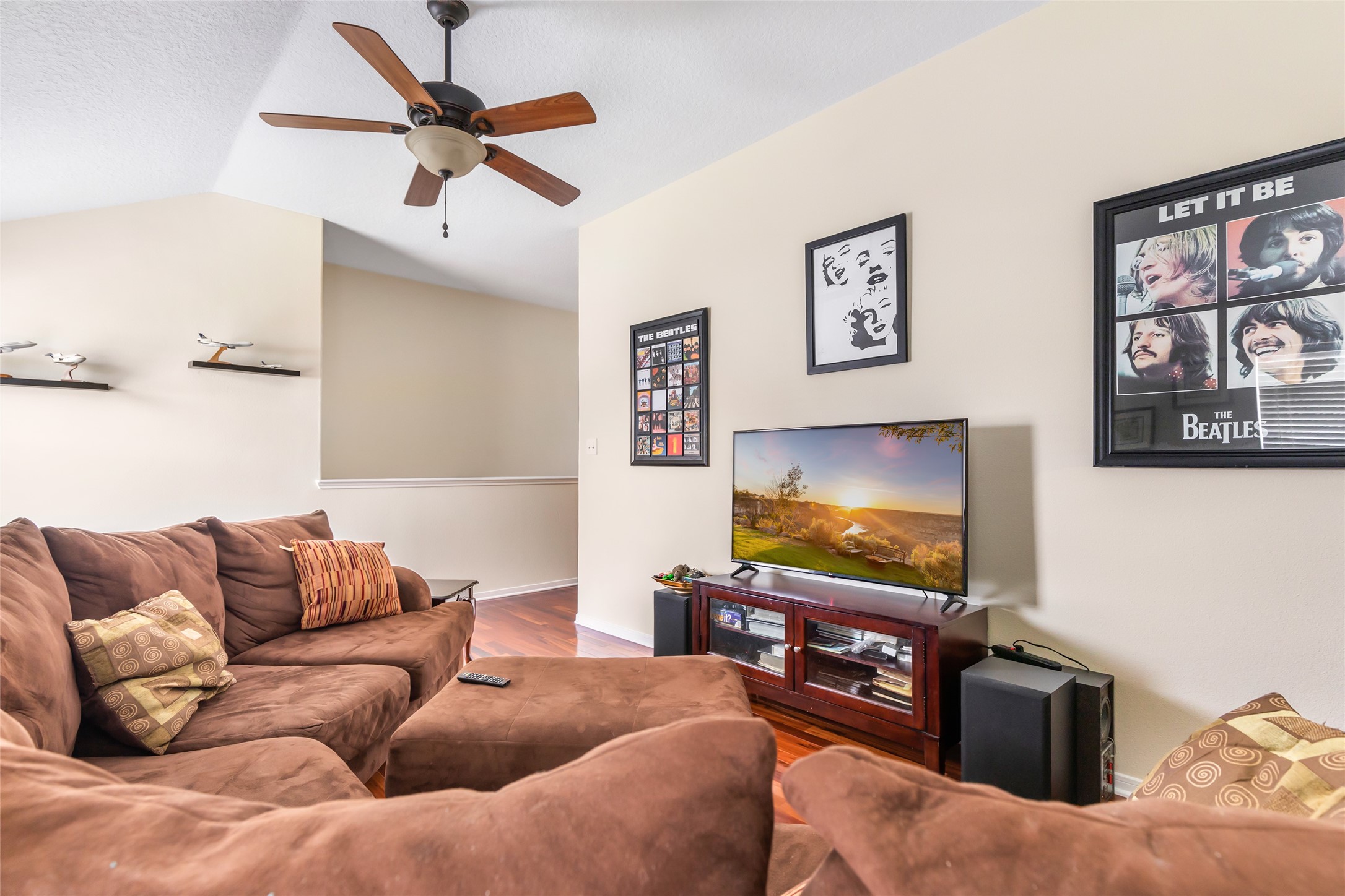 12122 Landsdown Ridge Way Humble, TX 77346 - Photo 32 of 34 a living room with furniture and a flat screen tv