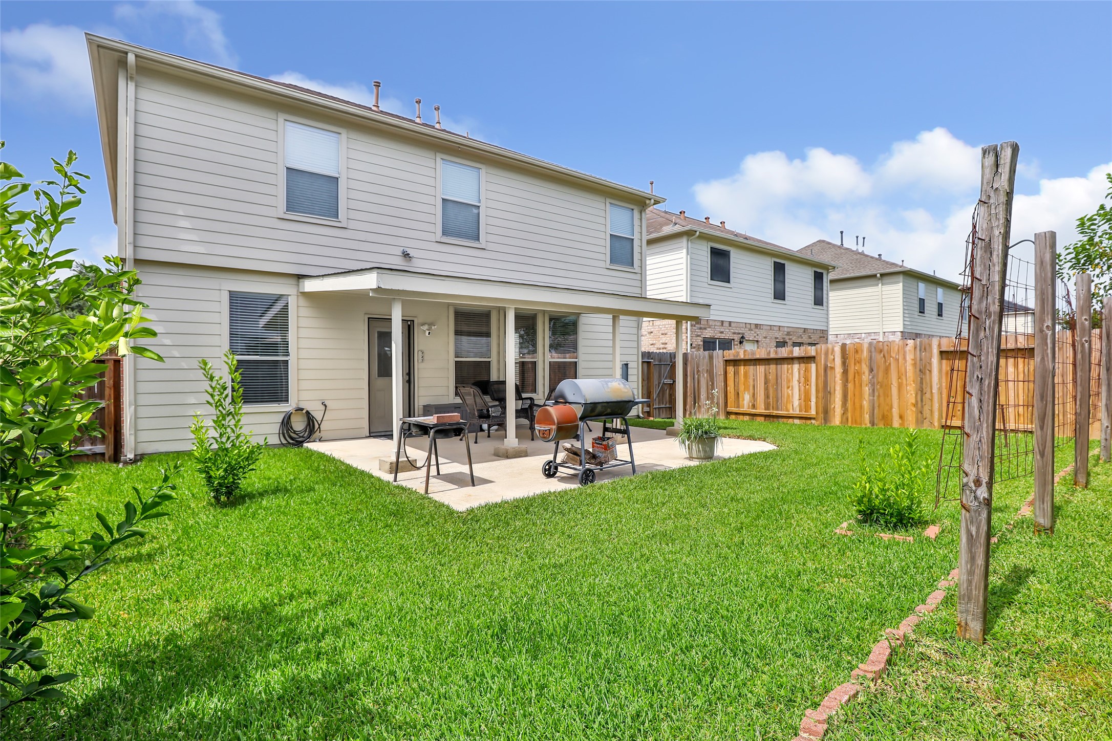 12122 Landsdown Ridge Way Humble, TX 77346 - Photo 5 of 34 a view of a house with backyard and porch
