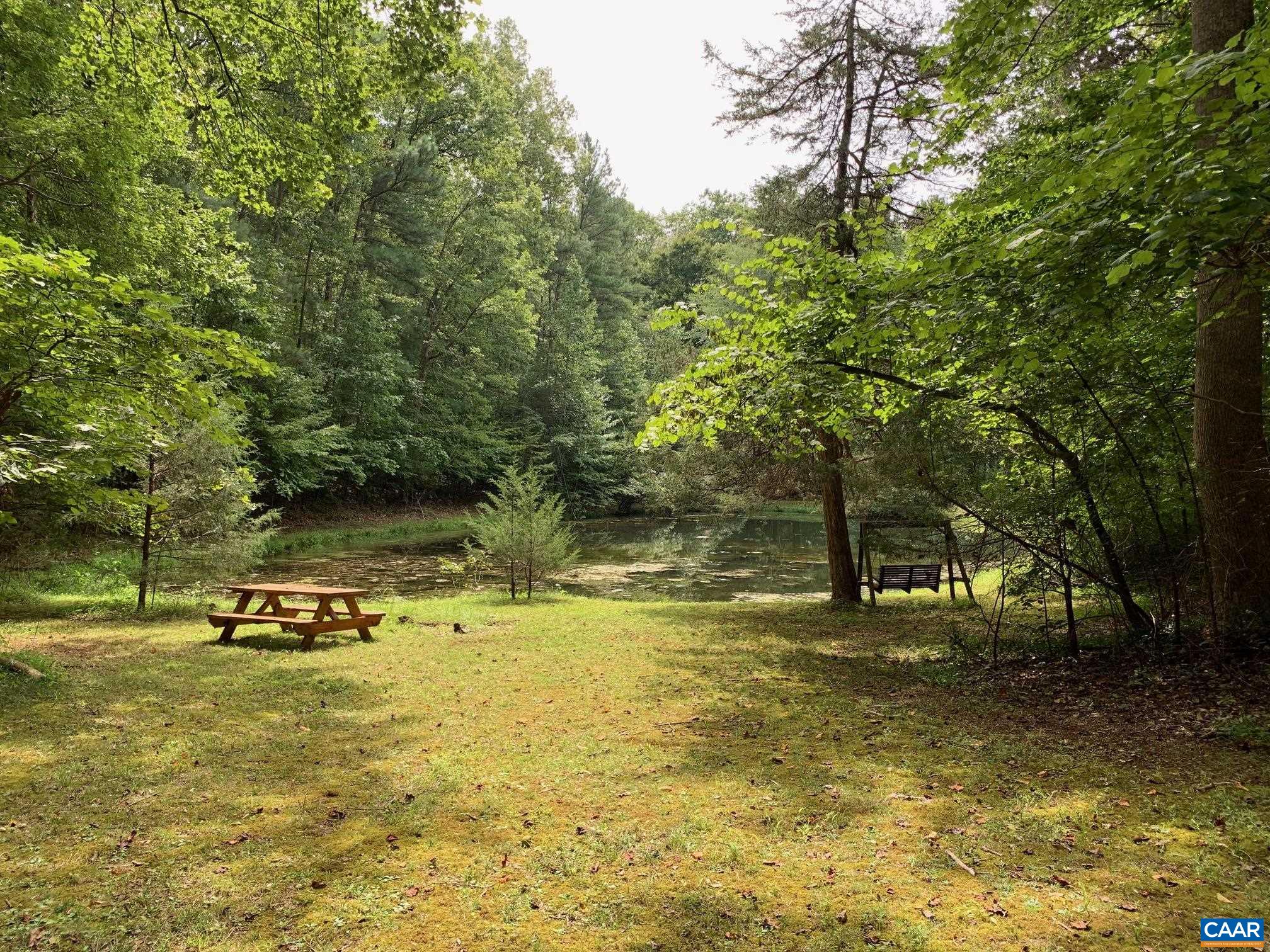 3981 South Blue Ridge Turnpike Rochelle, VA 22738 - Photo 1 of 15 a view of a swimming pool with a bench
