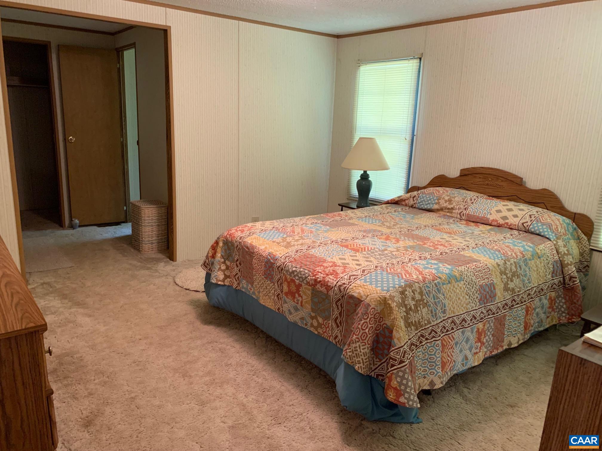 3981 South Blue Ridge Turnpike Rochelle, VA 22738 - Photo 14 of 15 a bedroom with a bed and window