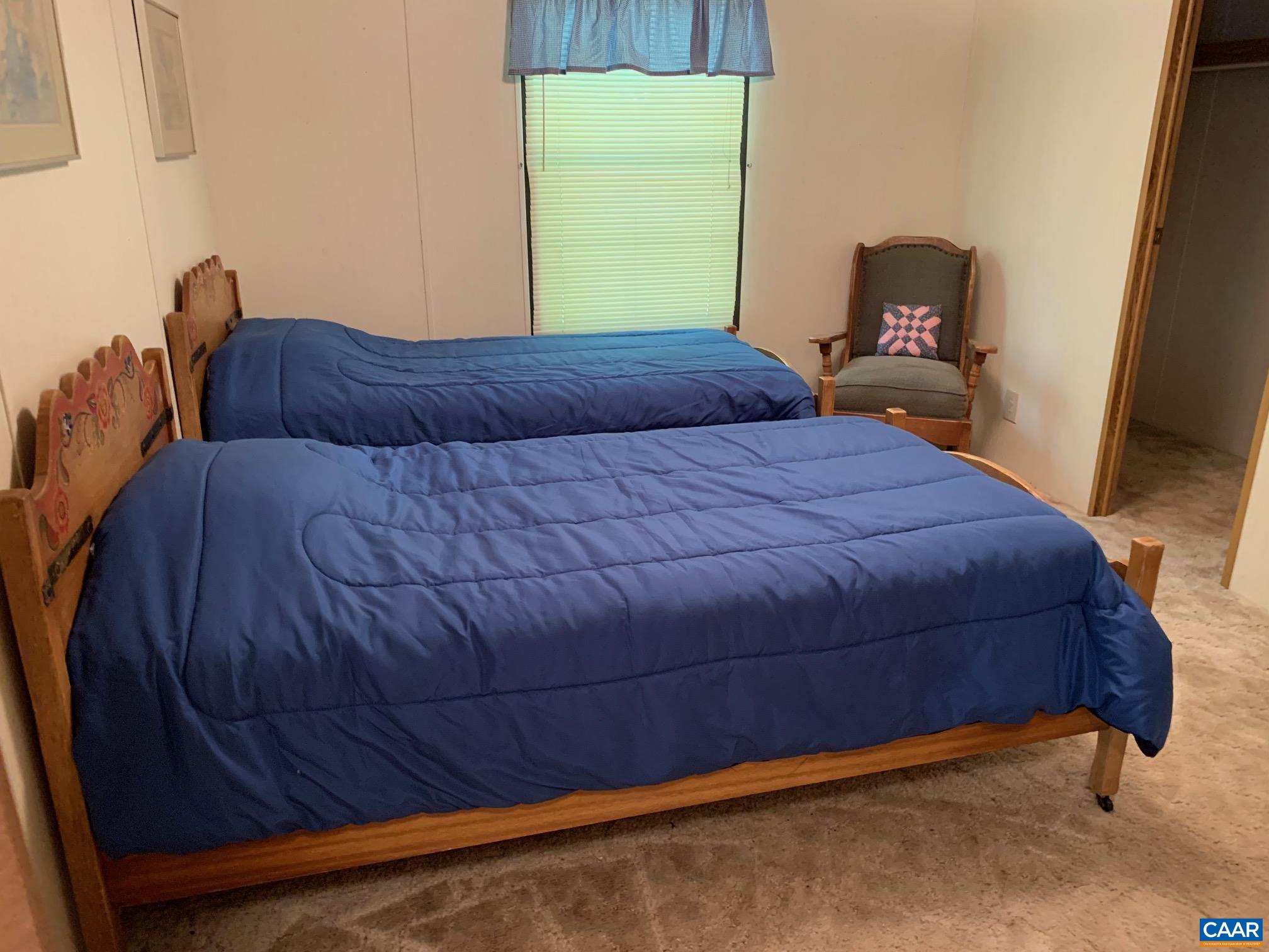 3981 South Blue Ridge Turnpike Rochelle, VA 22738 - Photo 15 of 15 a bedroom with a bed and window
