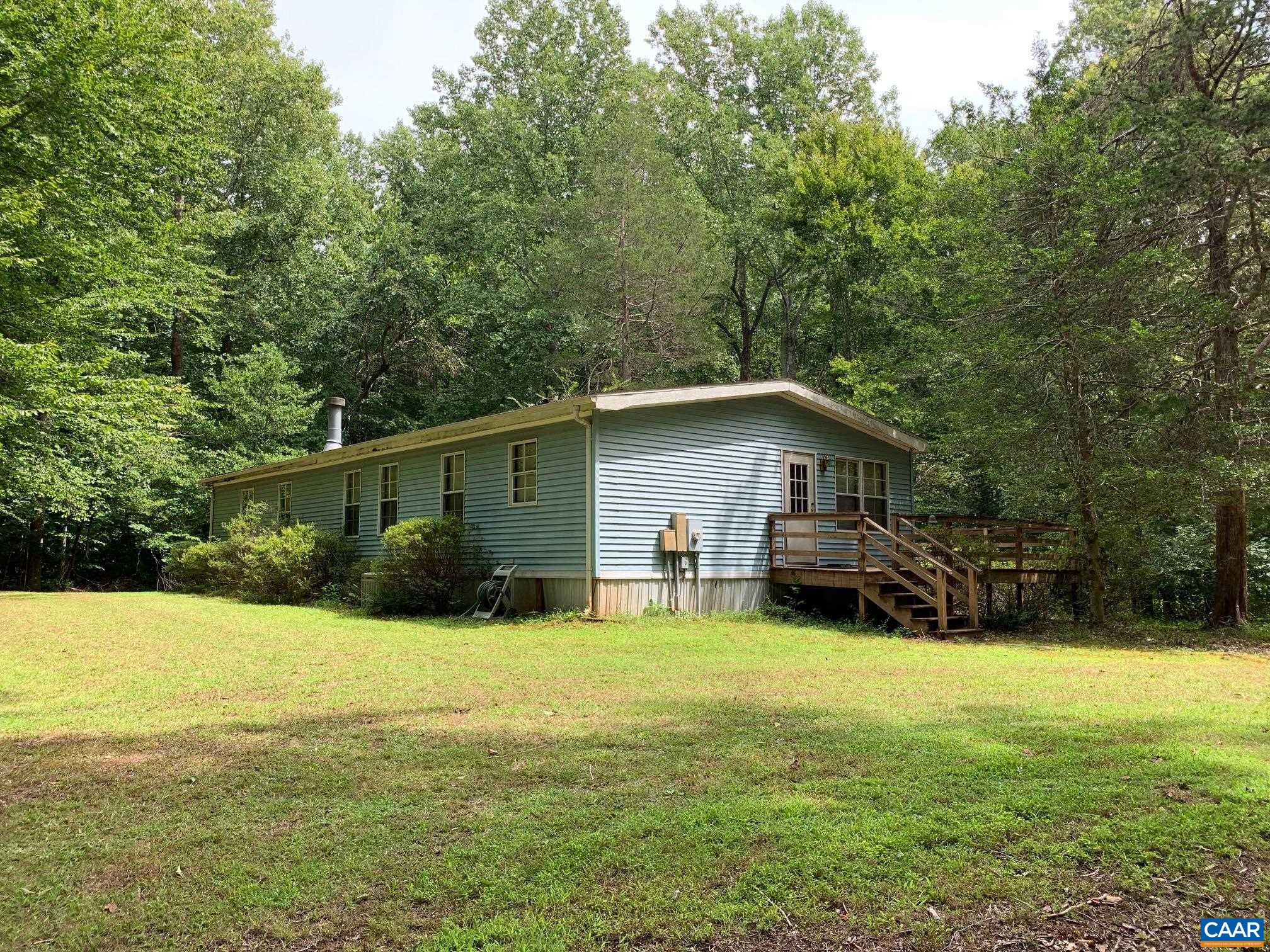 3981 South Blue Ridge Turnpike Rochelle, VA 22738 - Photo 8 of 15 a view of a house with a yard and sitting area