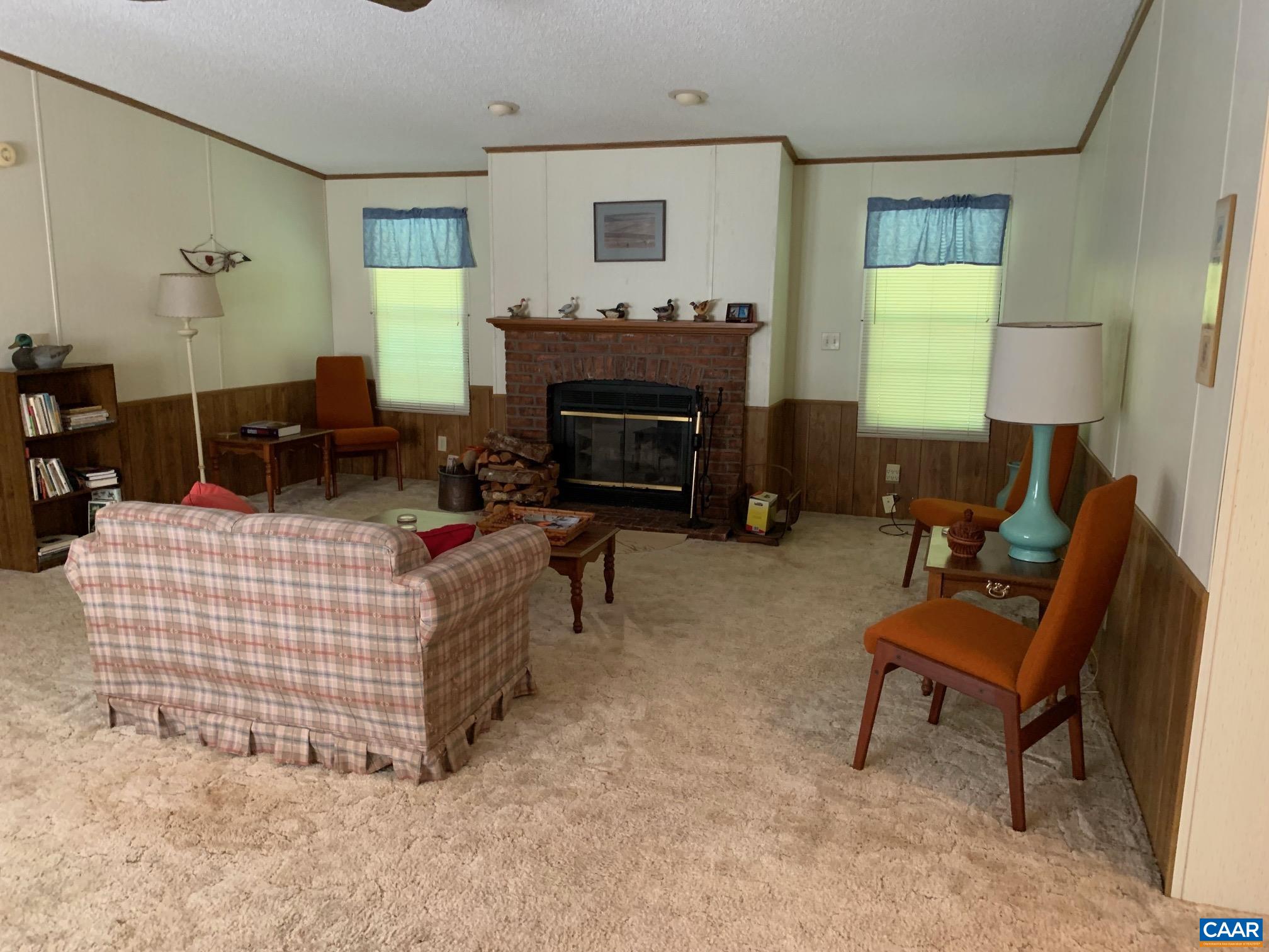 3981 South Blue Ridge Turnpike Rochelle, VA 22738 - Photo 10 of 15 a living room with furniture and a fireplace