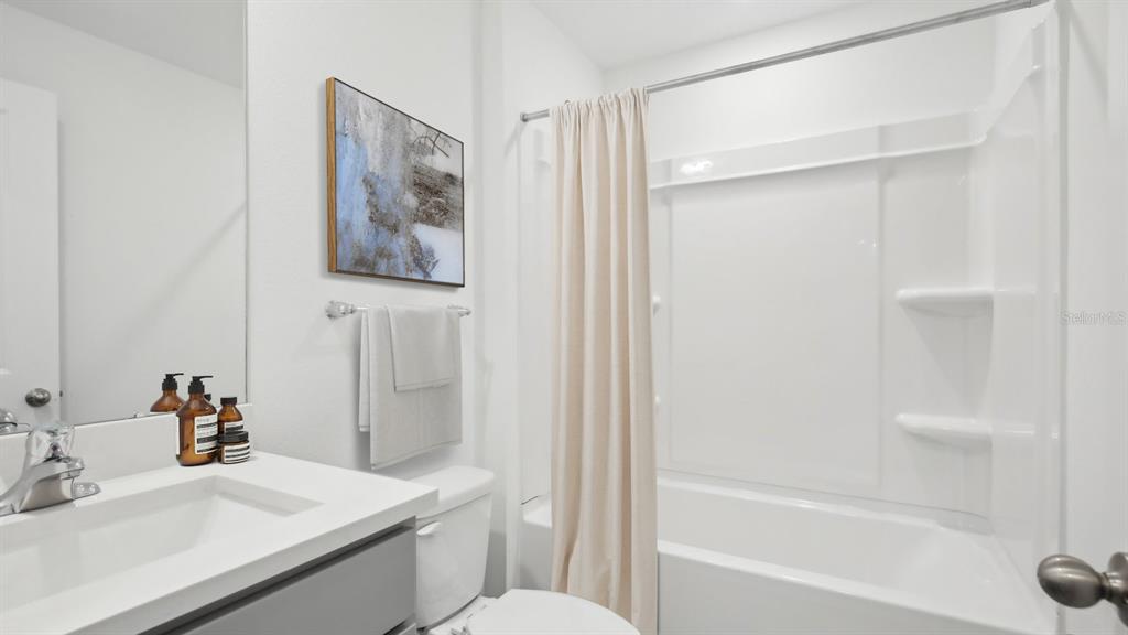 35353 Vly Rdg Road Dade City, FL 33525 - Photo 12 of 14 a bathroom with a sink toilet and shower