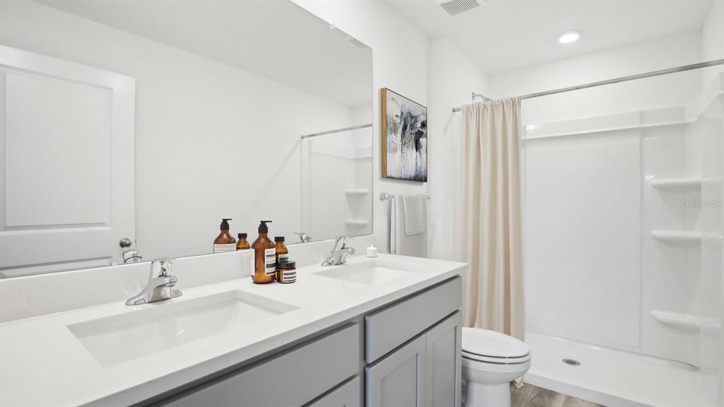 35353 Vly Rdg Road Dade City, FL 33525 - Photo 13 of 14 a bathroom with a sink toilet and shower