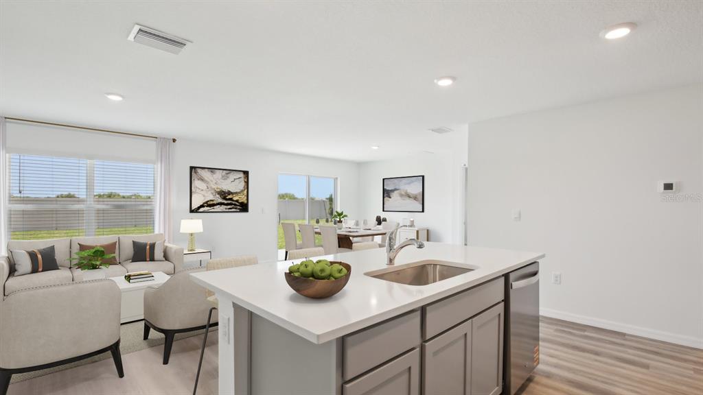 35353 Vly Rdg Road Dade City, FL 33525 - Photo 2 of 14 a kitchen with a sink cabinets and wooden floor