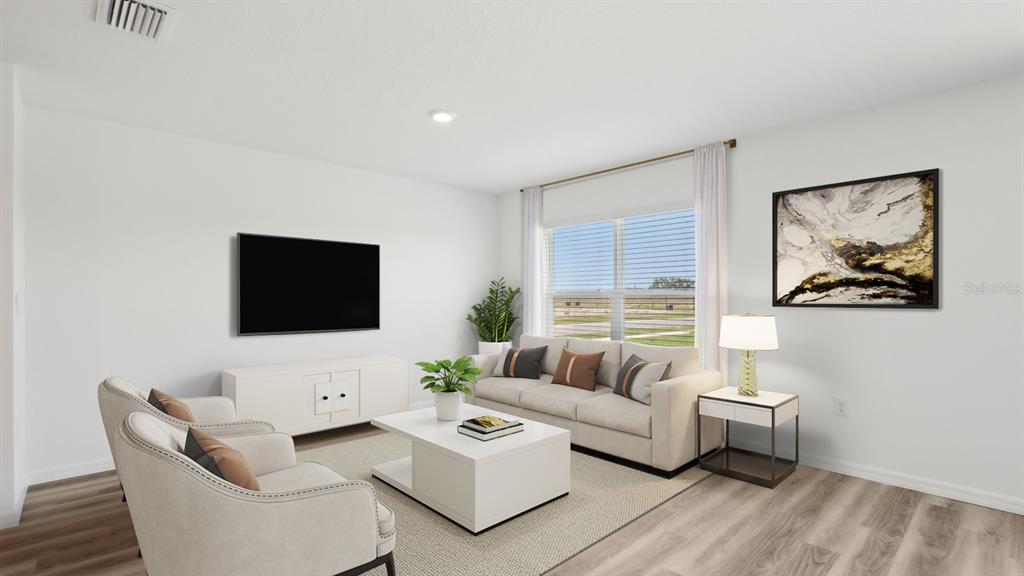 35353 Vly Rdg Road Dade City, FL 33525 - Photo 7 of 14 a living room with furniture and a flat screen tv