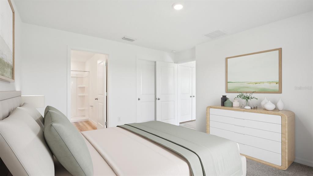 35353 Vly Rdg Road Dade City, FL 33525 - Photo 10 of 14 a bedroom with a bed and a dresser