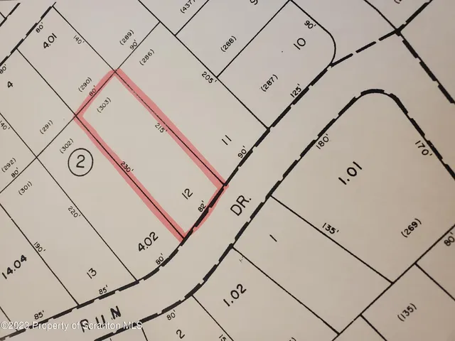 a utility room with dryer and white walls