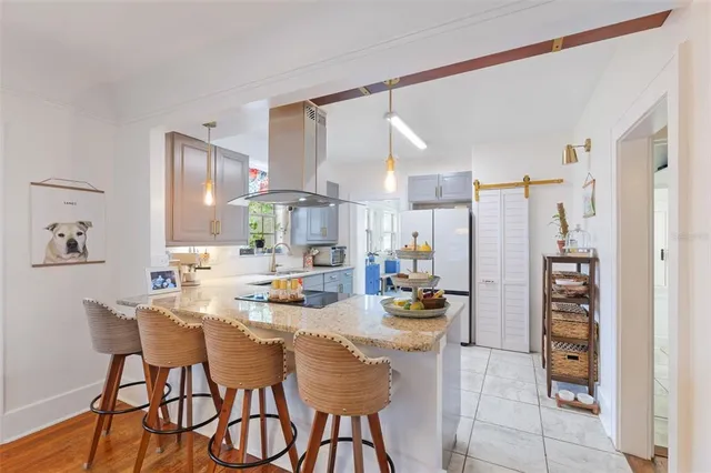 a dining room with furniture and a chandelier