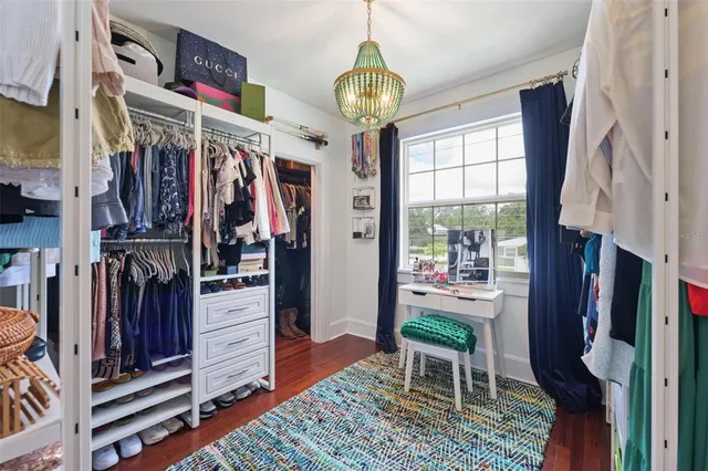 a living room with lots of furniture and a window