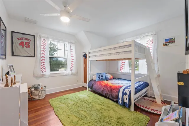 a bedroom with a bed and a couch