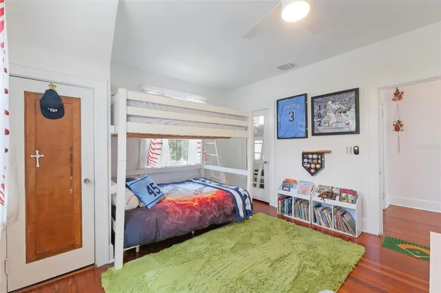 a bedroom with bed and a window