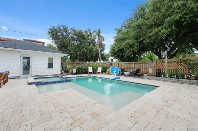 a view of a swimming pool with a lounge chair