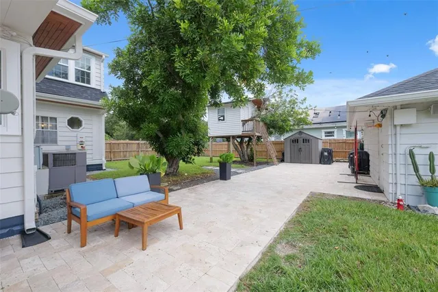 a view of a patio with a table and chairs