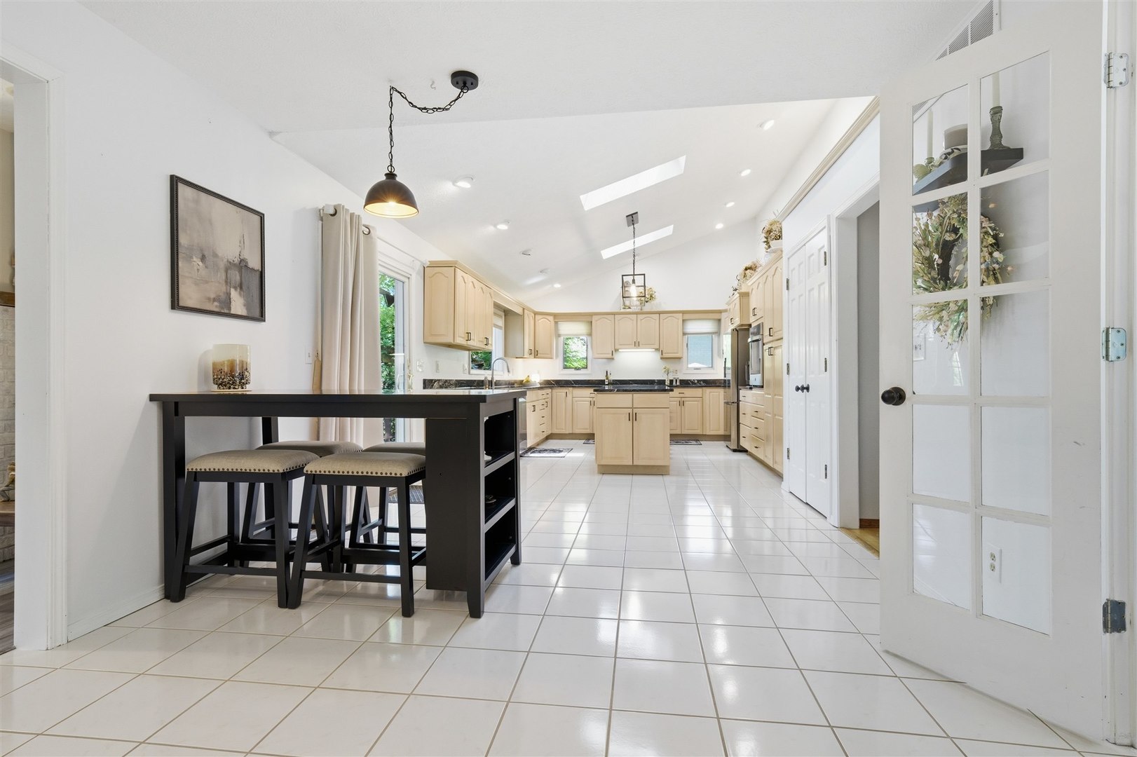 501 Augustine Way Normal, IL 61761 - Photo 17 of 43 a view of a kitchen with furniture and a chandelier