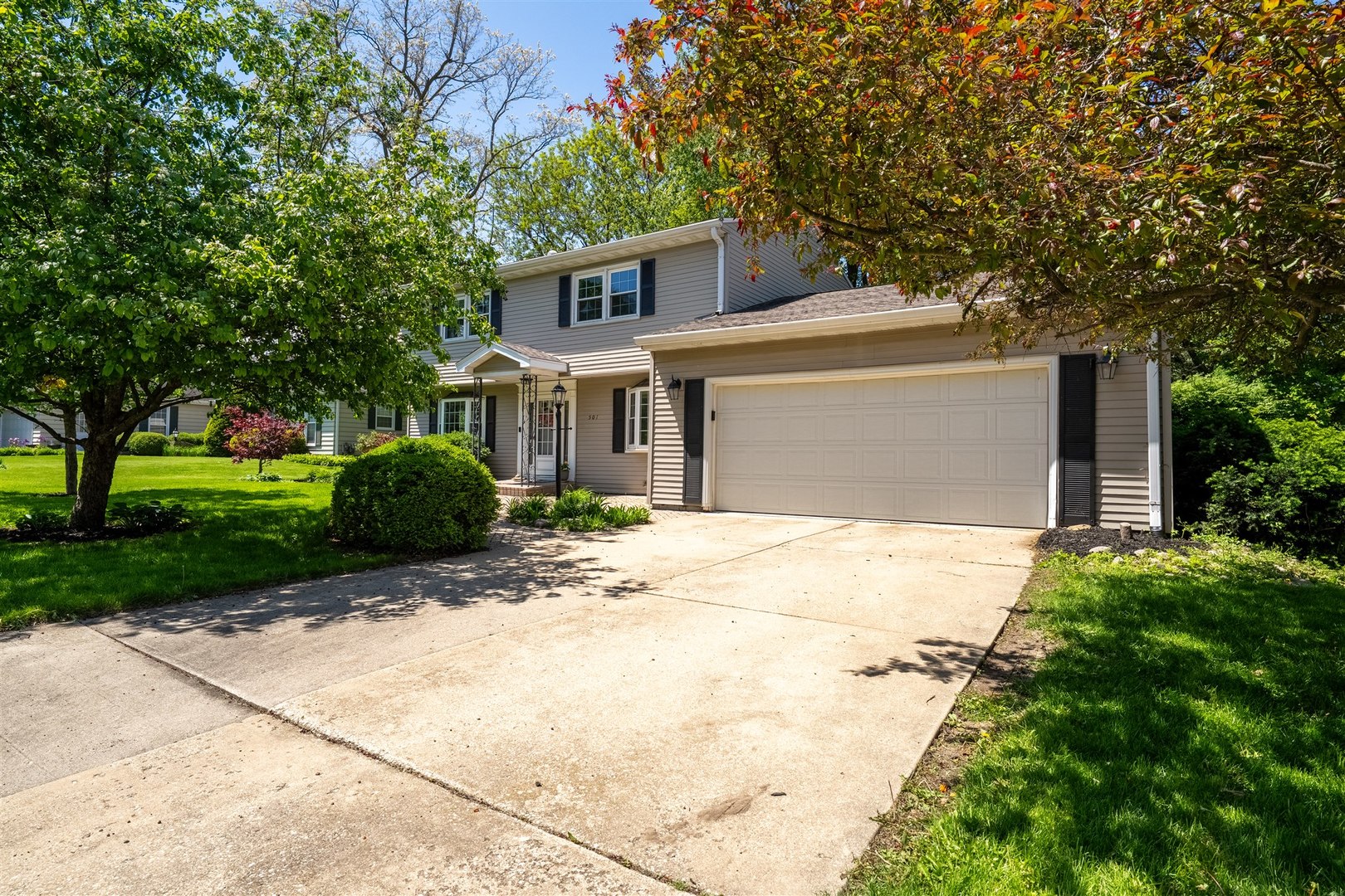 501 Augustine Way Normal, IL 61761 - Photo 2 of 43 a front view of a house with a garden