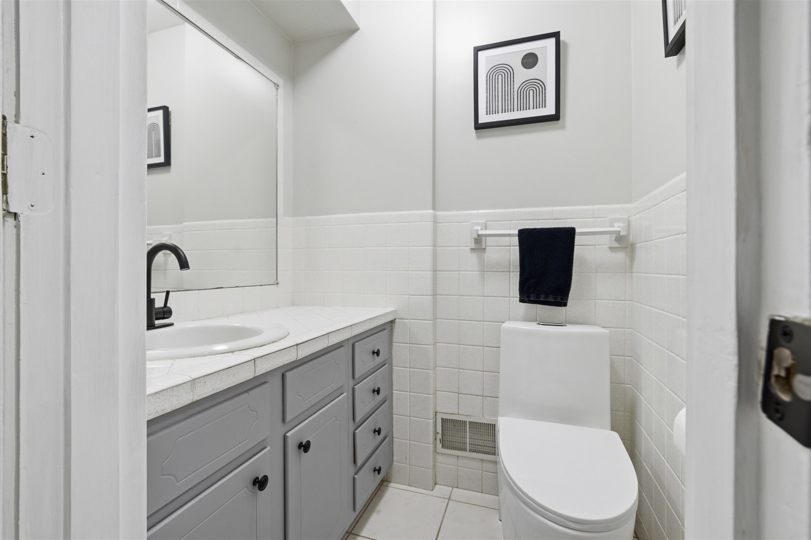 501 Augustine Way Normal, IL 61761 - Photo 24 of 43 a bathroom with a toilet a sink and mirror