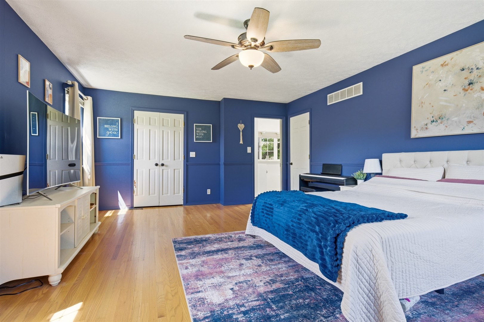 501 Augustine Way Normal, IL 61761 - Photo 26 of 43 a living room with a bed furniture and paintings on the wall