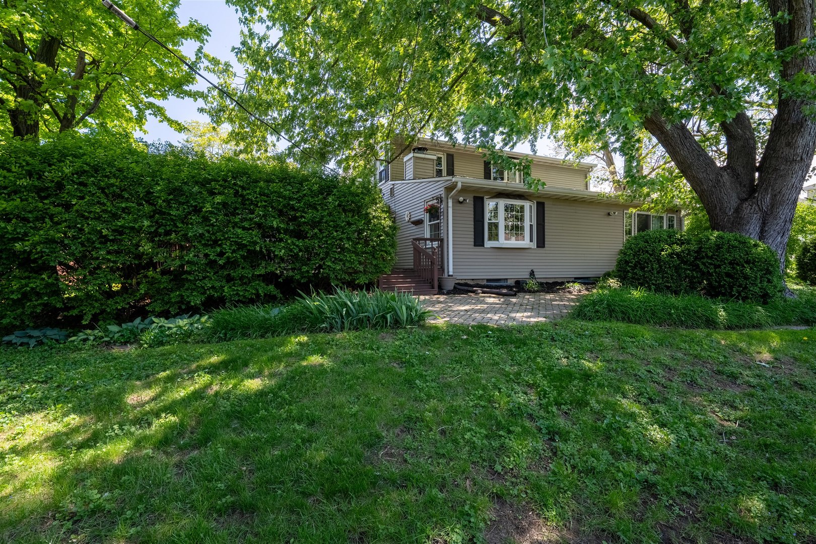 501 Augustine Way Normal, IL 61761 - Photo 39 of 43 a view of a tree in front of a house