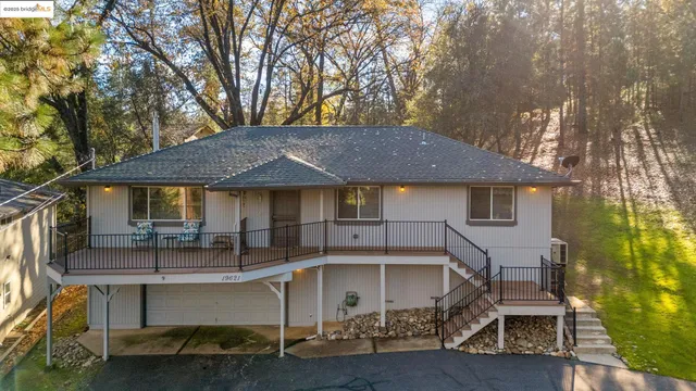 a kitchen with a table chairs stove and kitchen view