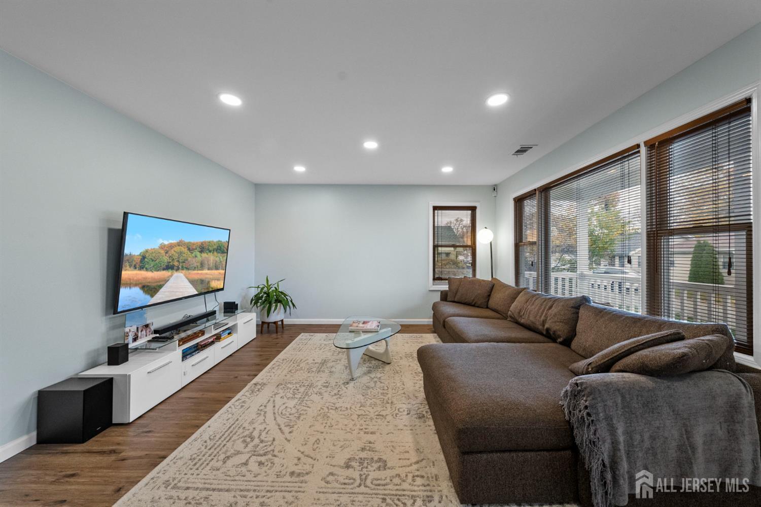 243 Alpine Way Old Bridge, NJ 08879 - Photo 11 of 45 a living room with furniture and a flat screen tv