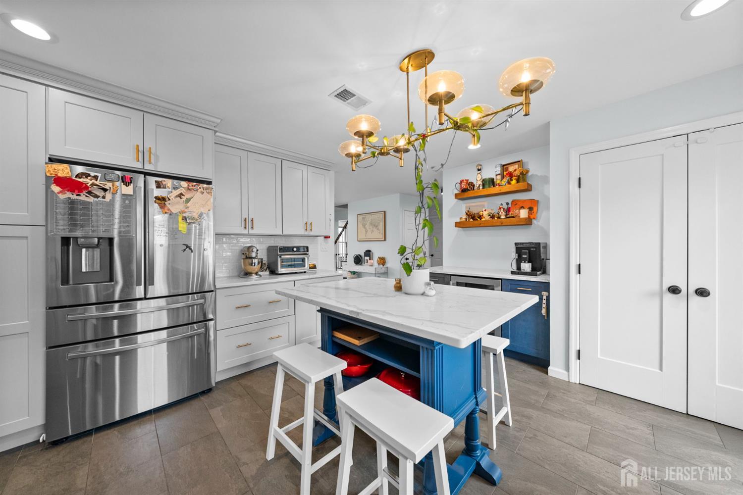 243 Alpine Way Old Bridge, NJ 08879 - Photo 16 of 45 a kitchen with a refrigerator and microwave