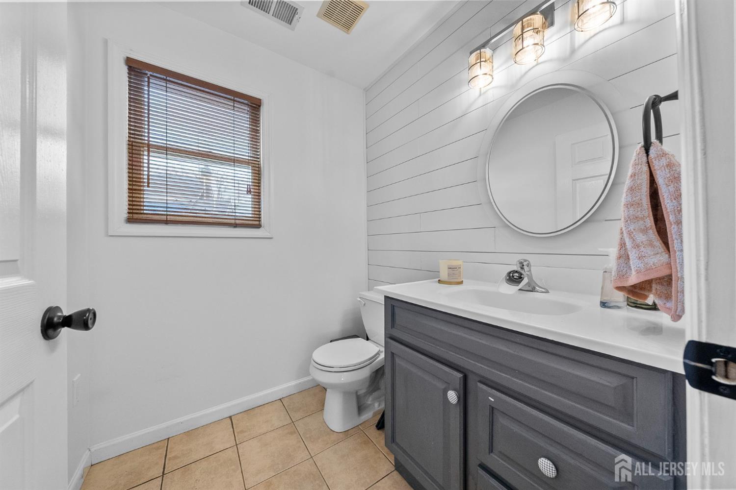 243 Alpine Way Old Bridge, NJ 08879 - Photo 18 of 45 a bathroom with a toilet sink and mirror
