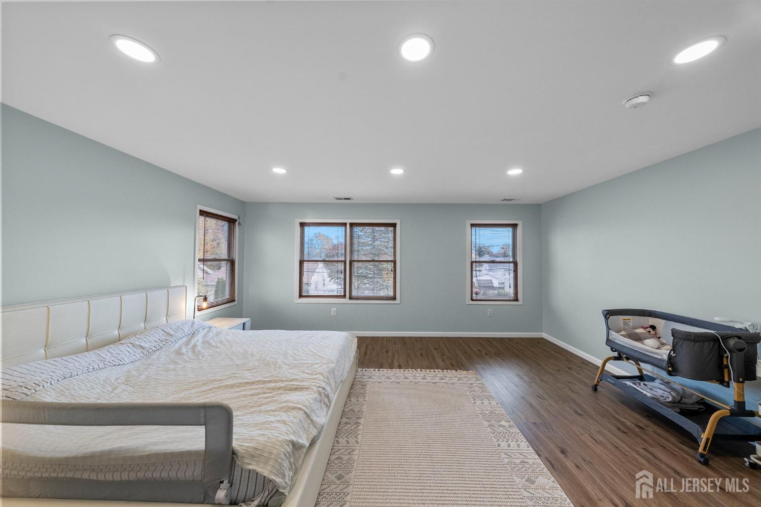 243 Alpine Way Old Bridge, NJ 08879 - Photo 26 of 45 a bedroom with a bed and wooden floor