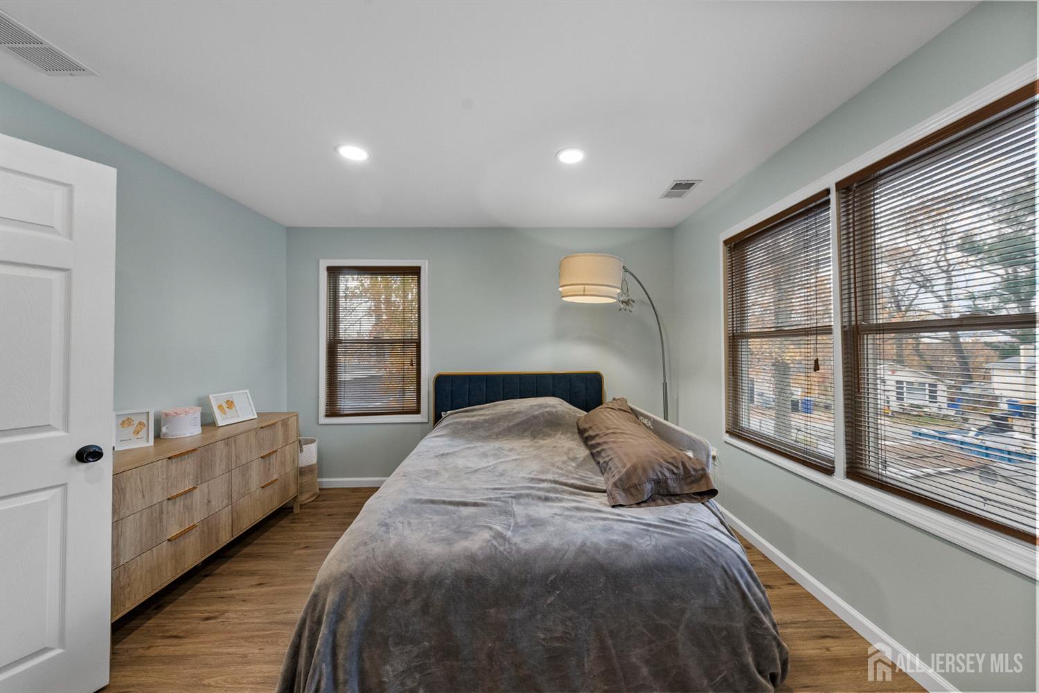 243 Alpine Way Old Bridge, NJ 08879 - Photo 31 of 45 a spacious bedroom with a large bed and a large window