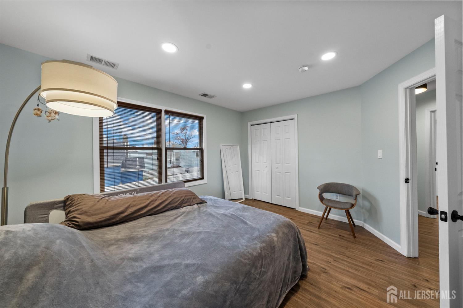 243 Alpine Way Old Bridge, NJ 08879 - Photo 32 of 45 a bedroom with a bed and a large window