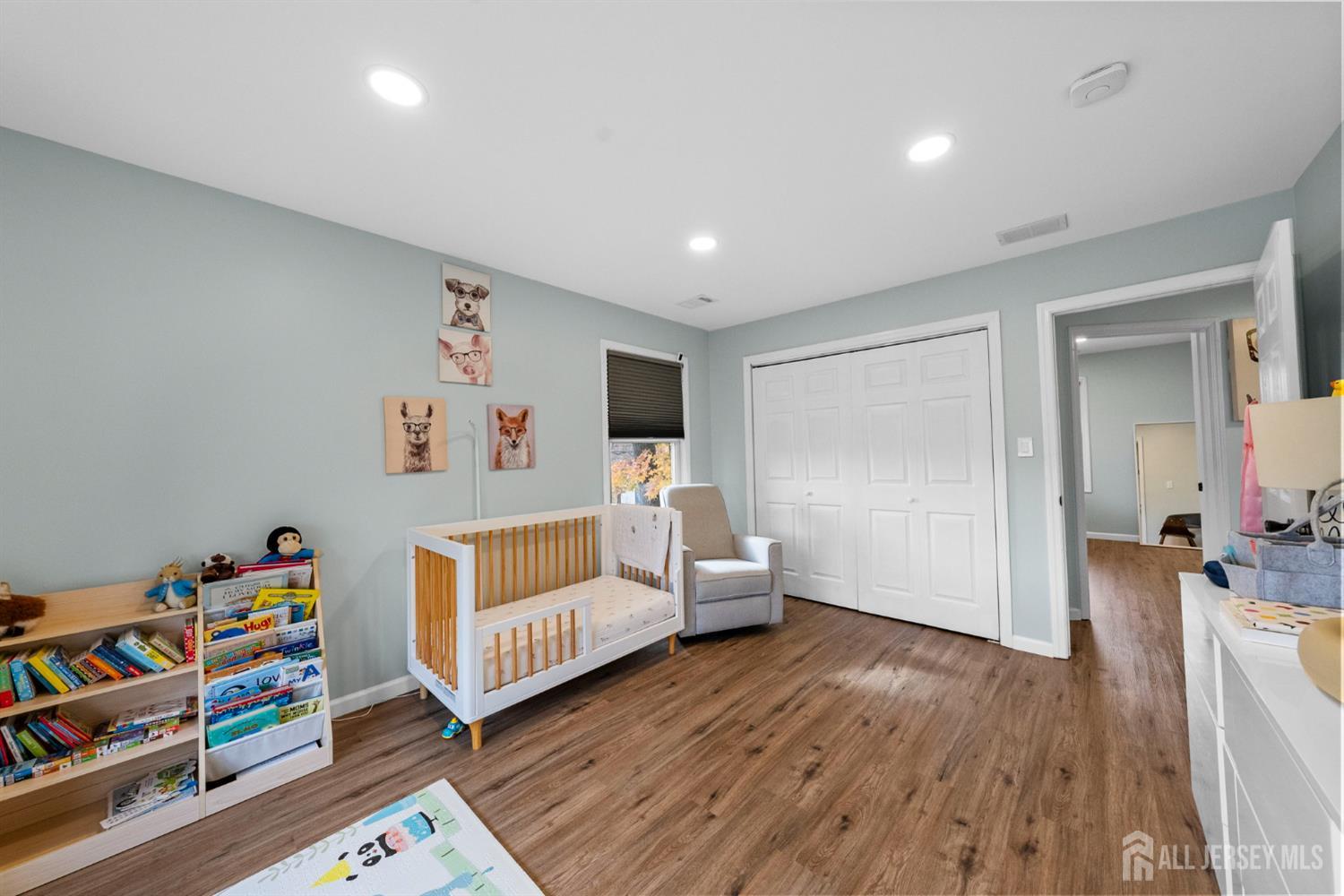 243 Alpine Way Old Bridge, NJ 08879 - Photo 34 of 45 a living room with furniture and a wooden floor