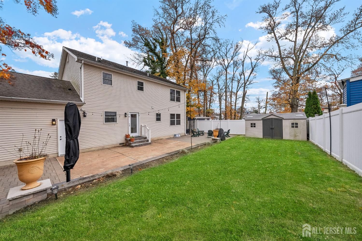 243 Alpine Way Old Bridge, NJ 08879 - Photo 36 of 45 a view of a backyard with a garden and tree