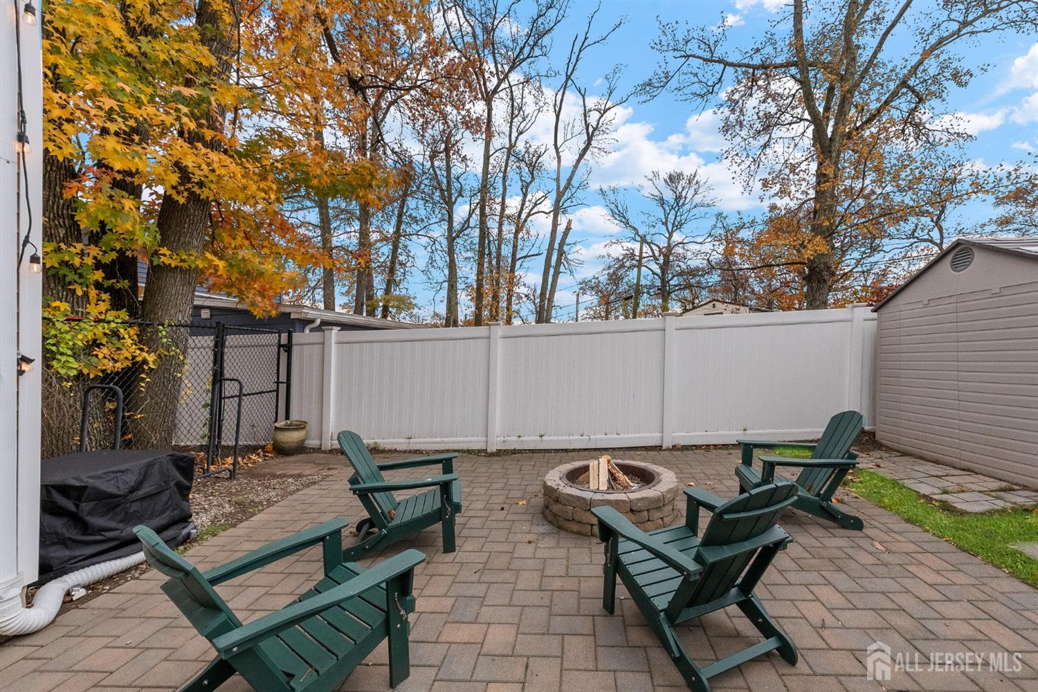 243 Alpine Way Old Bridge, NJ 08879 - Photo 38 of 45 a backyard of a house with table and chairs