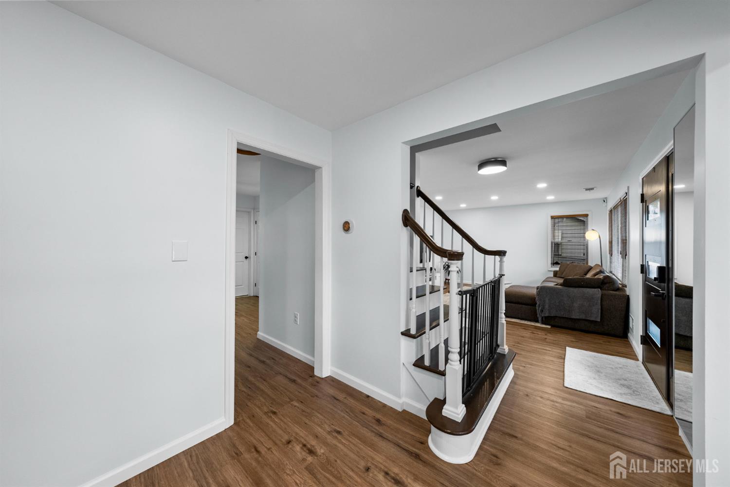 243 Alpine Way Old Bridge, NJ 08879 - Photo 8 of 45 a view of an entryway with wooden floor and stairs