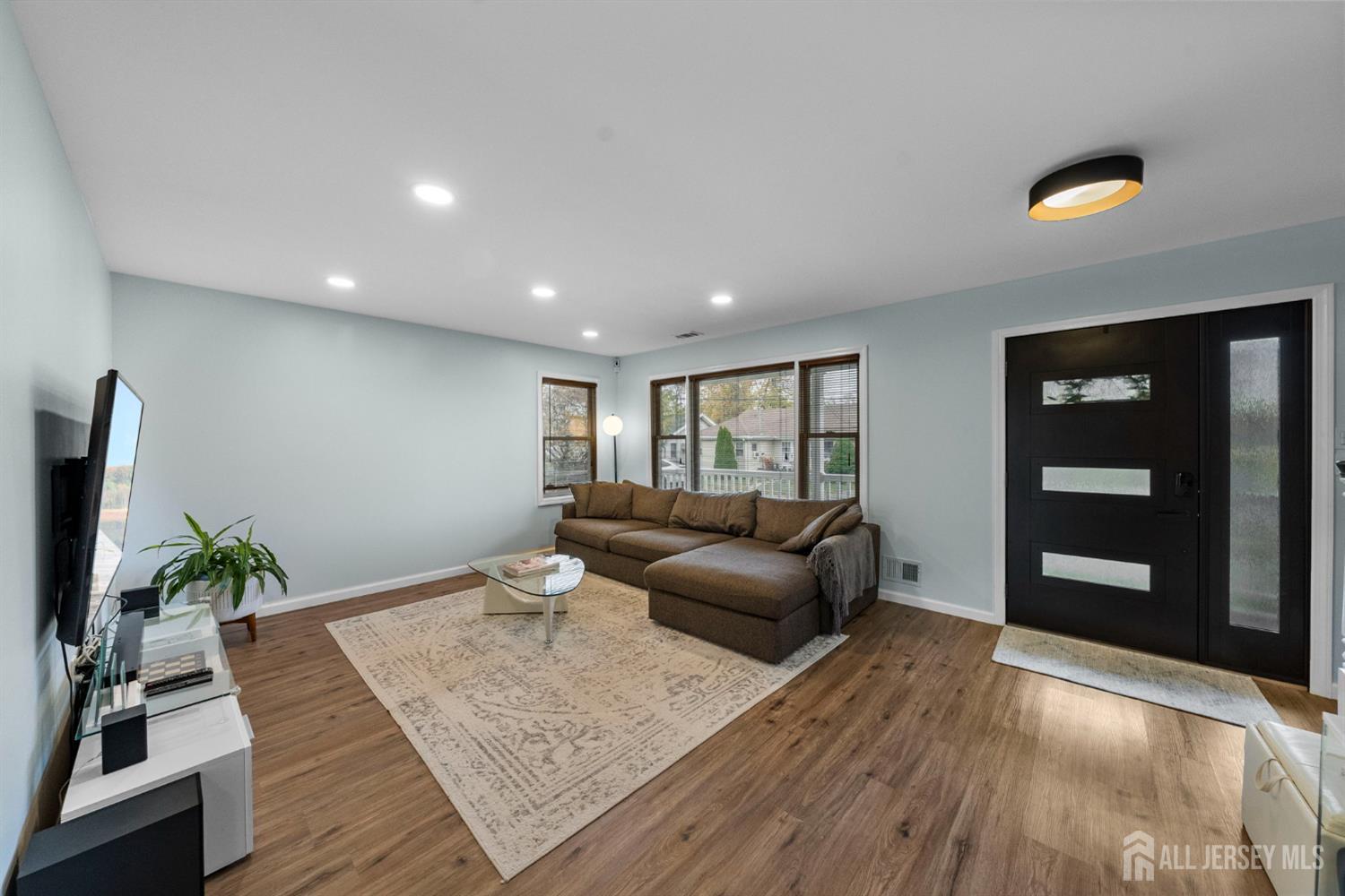 243 Alpine Way Old Bridge, NJ 08879 - Photo 10 of 45 a living room with furniture and a flat screen tv