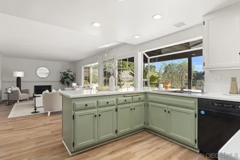 a living room with furniture and large windows