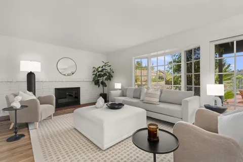 a living room with furniture and a fireplace