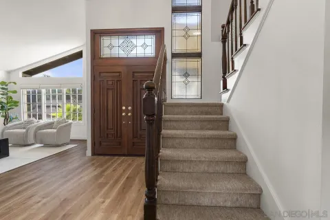 a view of balcony with wooden floor and city view