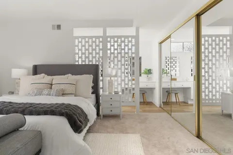 a bathroom with a sink a mirror and a shower