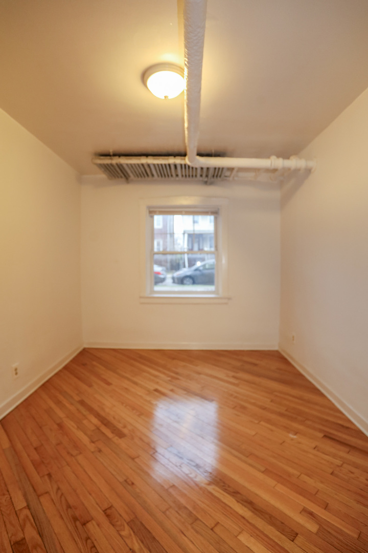 2453 West Gunnison Street, Unit G Chicago, IL 60625 - Photo 7 of 9 wooden floor in a room