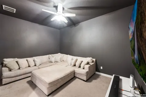 a white couch sitting in a living room with a couch