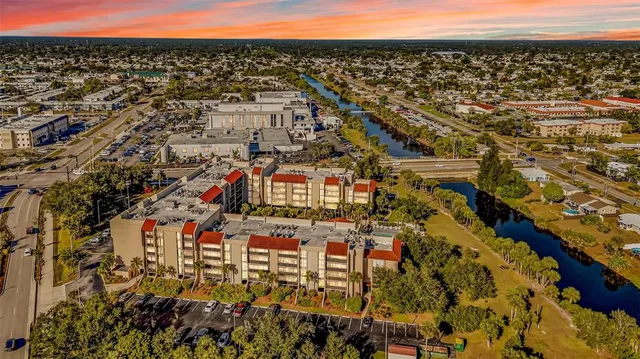 a view of a patio with chairs and a table