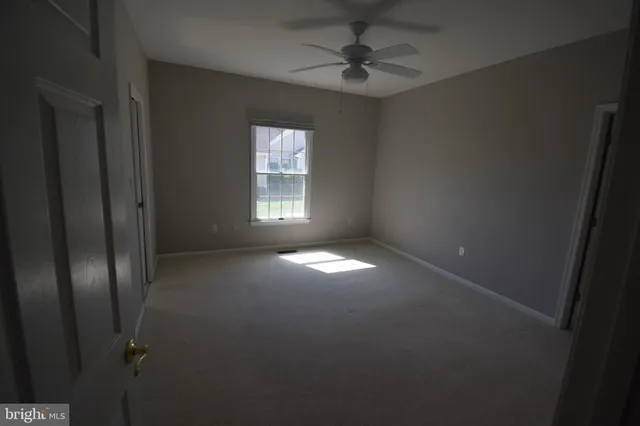 a view of empty room with windows