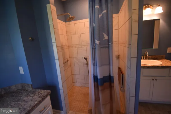 a bathroom with a sink and mirror