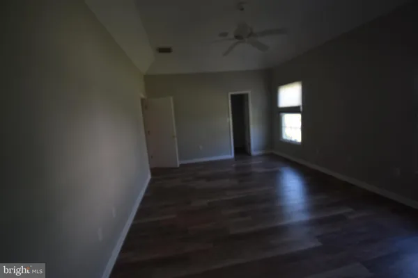 a view of livingroom and hall with wooden floor