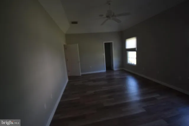 a view of livingroom and hall with wooden floor