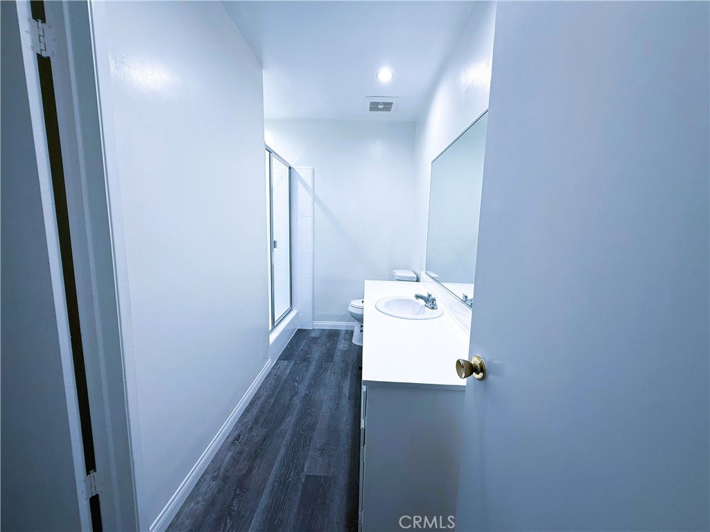 525 Fischer Street, Unit 1 Glendale, CA 91205 - Photo 11 of 25 a bathroom with a sink toilet and vanity