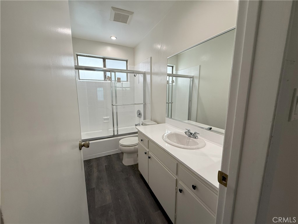 525 Fischer Street, Unit 1 Glendale, CA 91205 - Photo 16 of 25 a bathroom with a double vanity sink toilet and shower