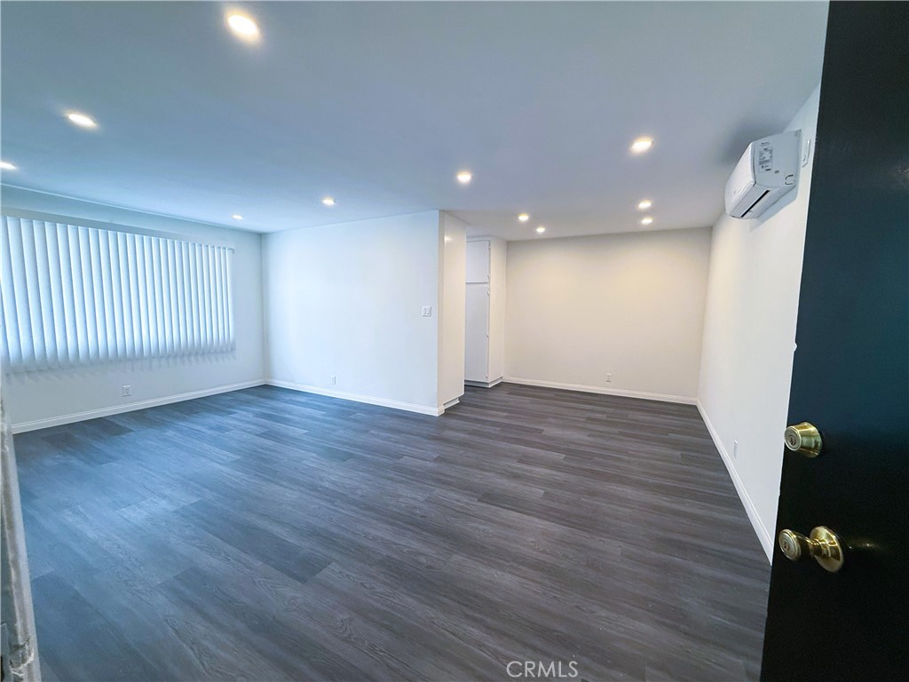 525 Fischer Street, Unit 1 Glendale, CA 91205 - Photo 19 of 25 a view of an empty room with wooden floor
